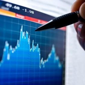 Hand pointing to chart with pen