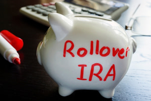 Piggy bank with "Rollover RIA" written on the side