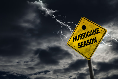 "Hurricane season" sign with bad weather in the background