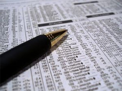 Pen on newspaper stock list