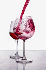 Pouring red wine into glass