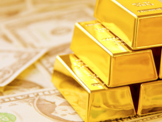 Gold bars on money