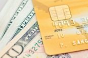 Credit card on top of bank notes