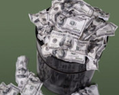 Crumpled money in a wastebasket