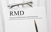The words "RMD: Required Minimum Distribution" on paper