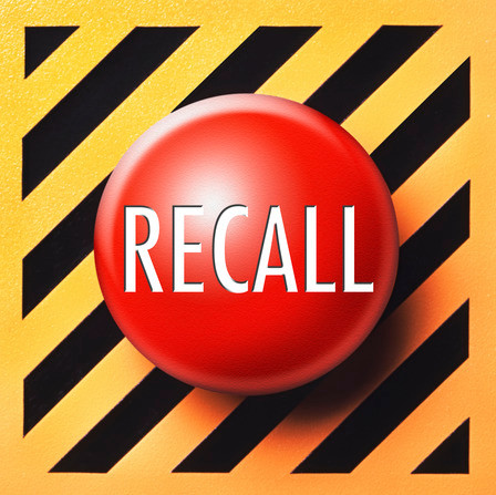 Red recall button on black and yellow lined background