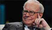 Picture of Warren Buffett with his hand on his face