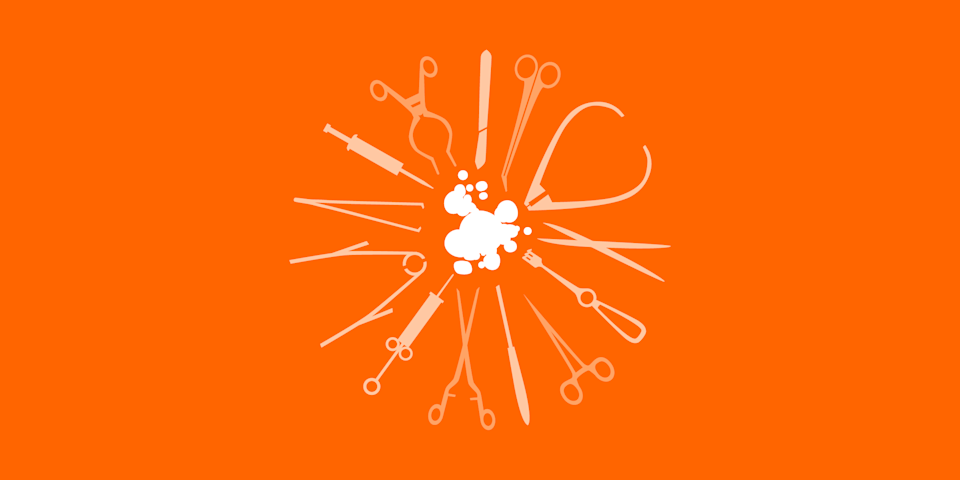 Surgical instruments pointing inwards forming a circle around a piece of endometrial-like tissue