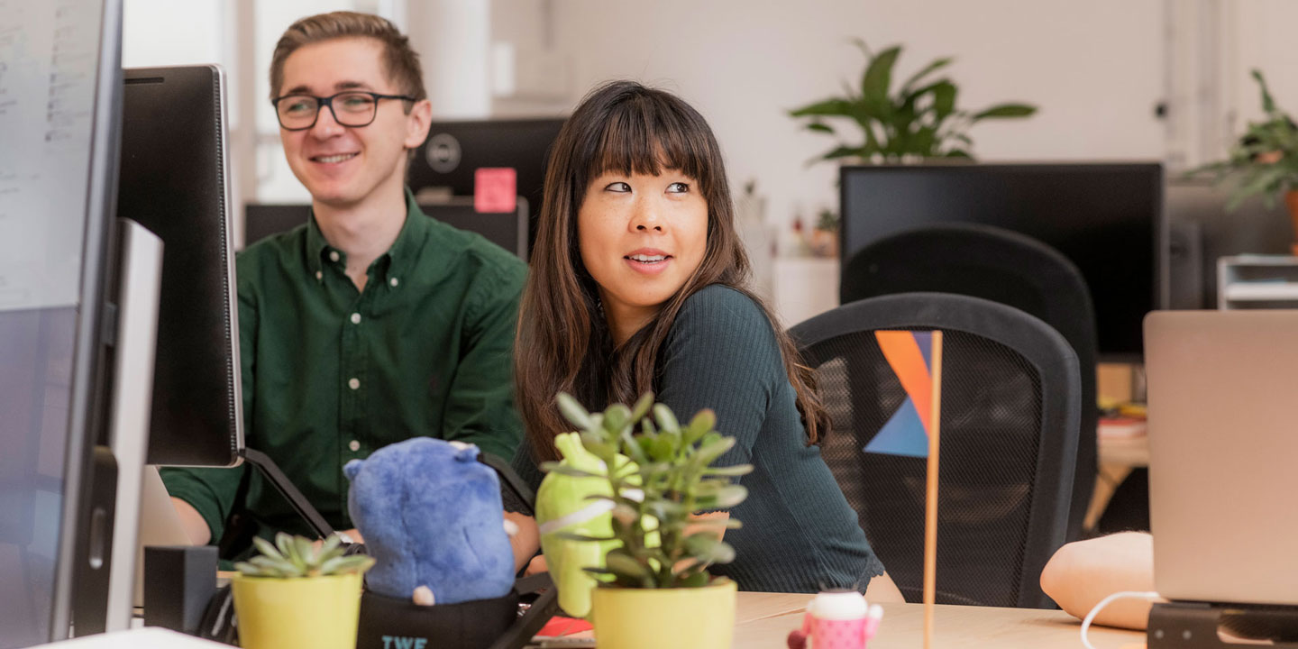 Two colleagues at their desk