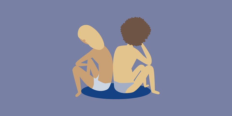 two seated figures lowering their heads while looking away