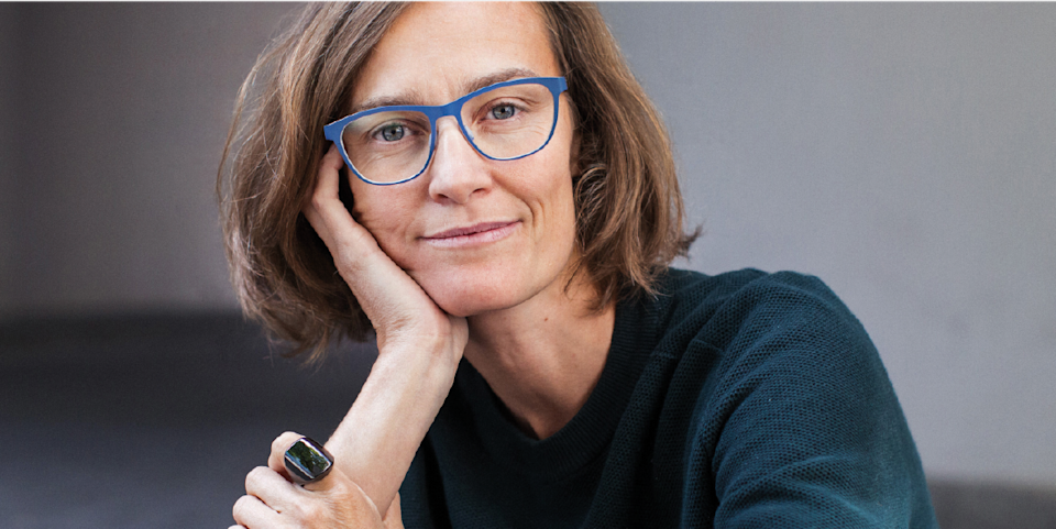 portrait of ida tin wearing blue glasses and an oura ring