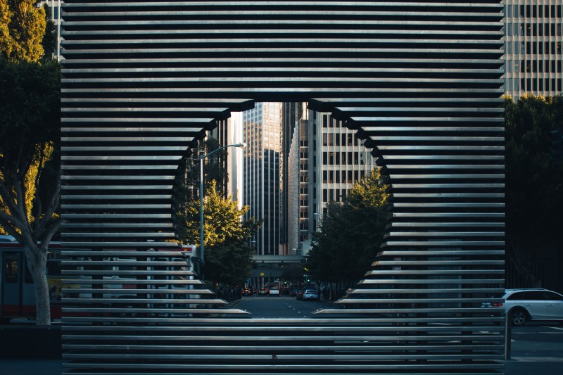 Image looking through a circle to a cityscape