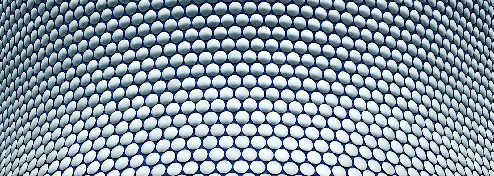 Image of close up of building with interlocking circular pattern on façade
