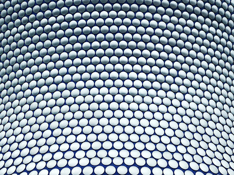 Image of close up of building with interlocking circular pattern on façade