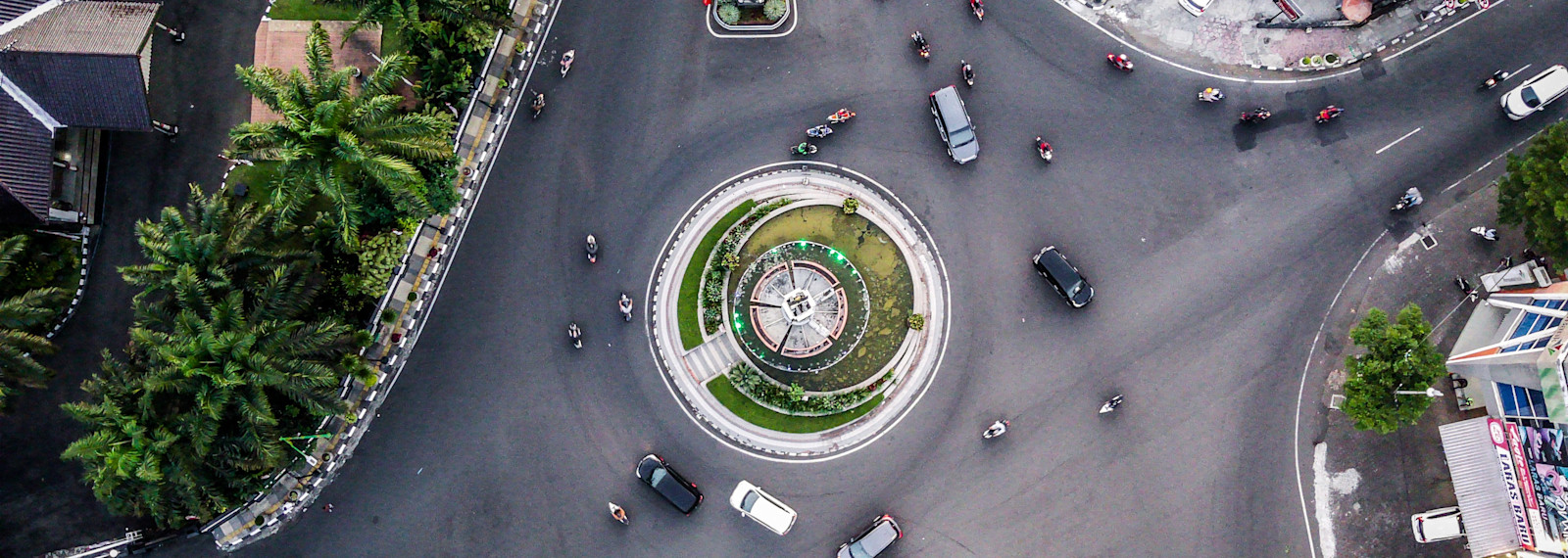 Image of aerial view of a roundabout with cars driving around it