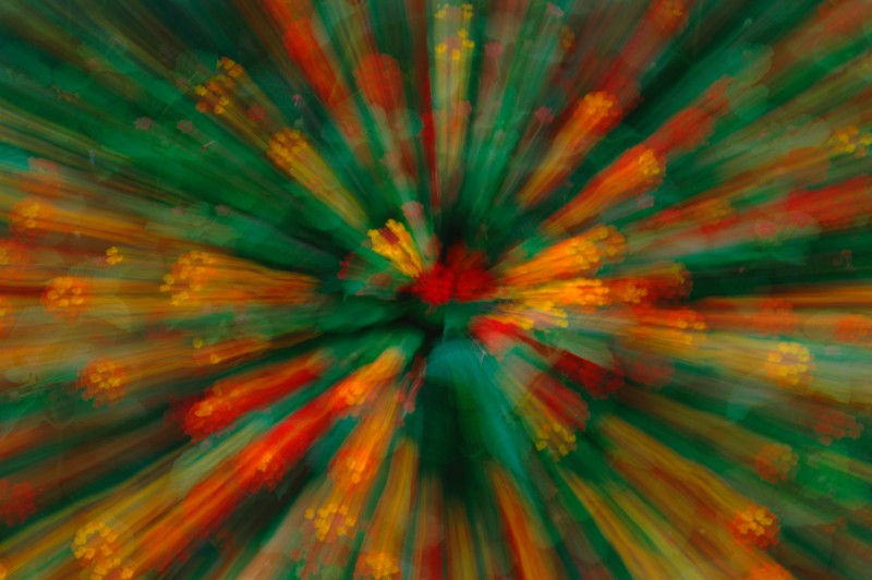 Abstract image of coloured lights leading to a central circle