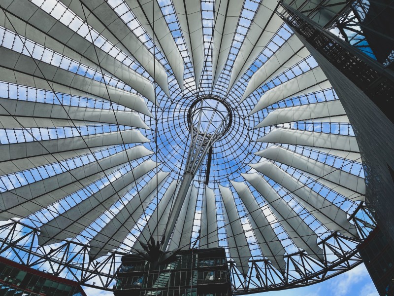 Image looking up into the inside of a circular glass structure