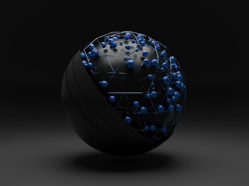 Image of a two sided sphere with blue pins in one side, resembling a globe