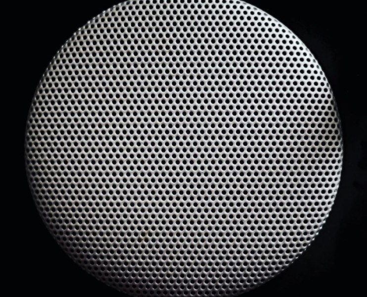 Close up of circular object with perforations 