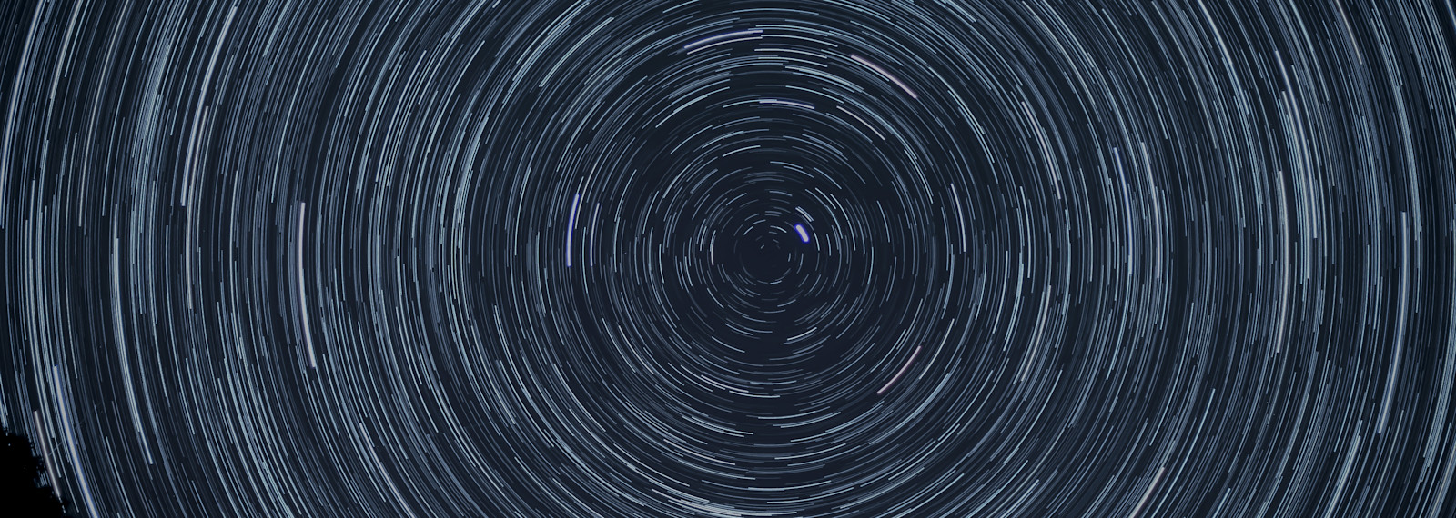 light patterns in the shape of a circle against the night sky