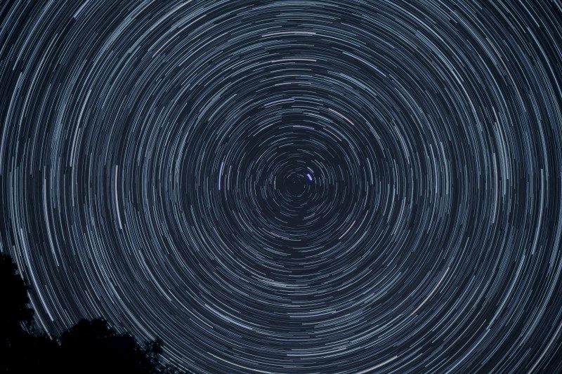 light patterns in the shape of a circle against the night sky