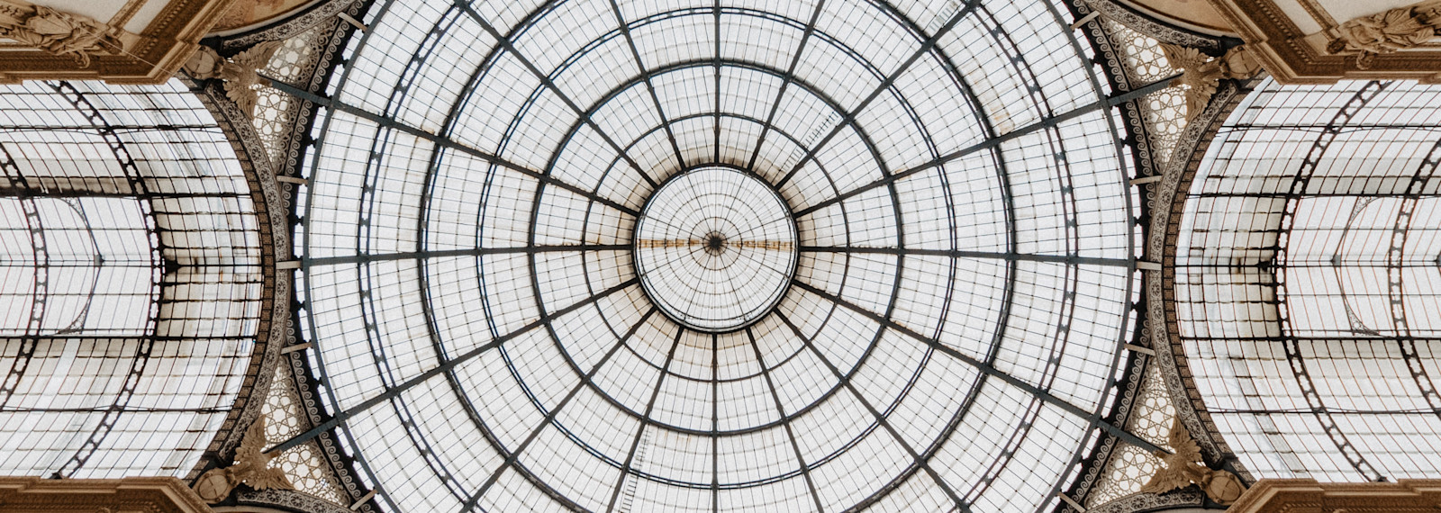 Image looking up towards a circular roof window