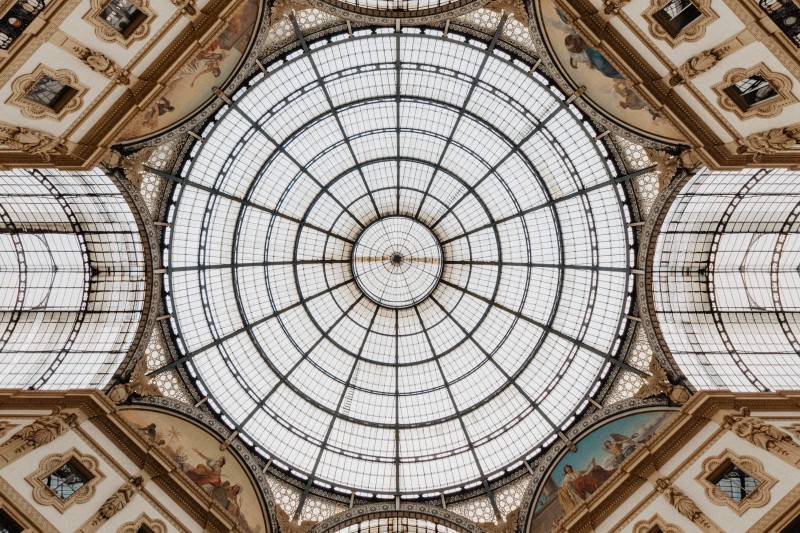 Image looking up towards a circular roof window