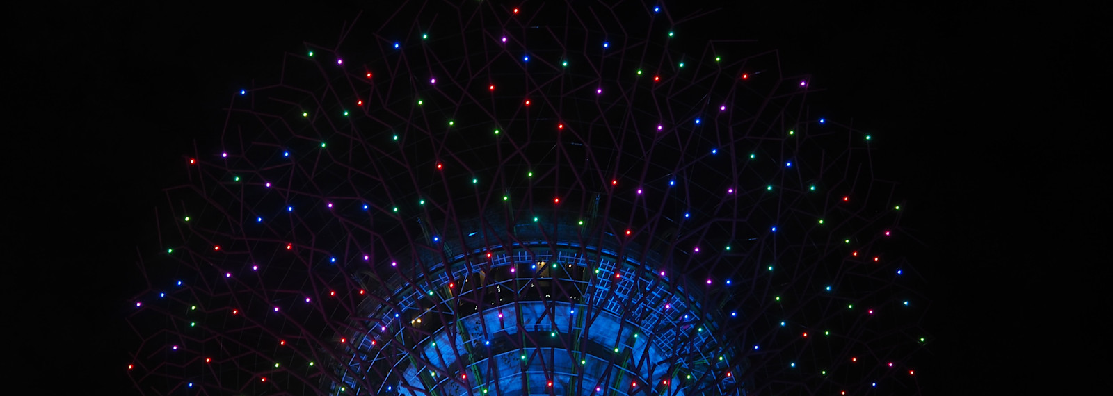 Image of lights ascending from a circular building