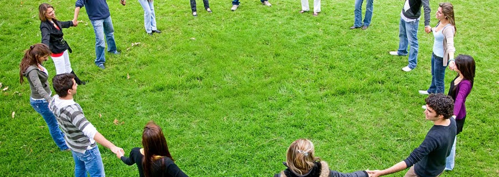 Image of a group of people standing in a circle