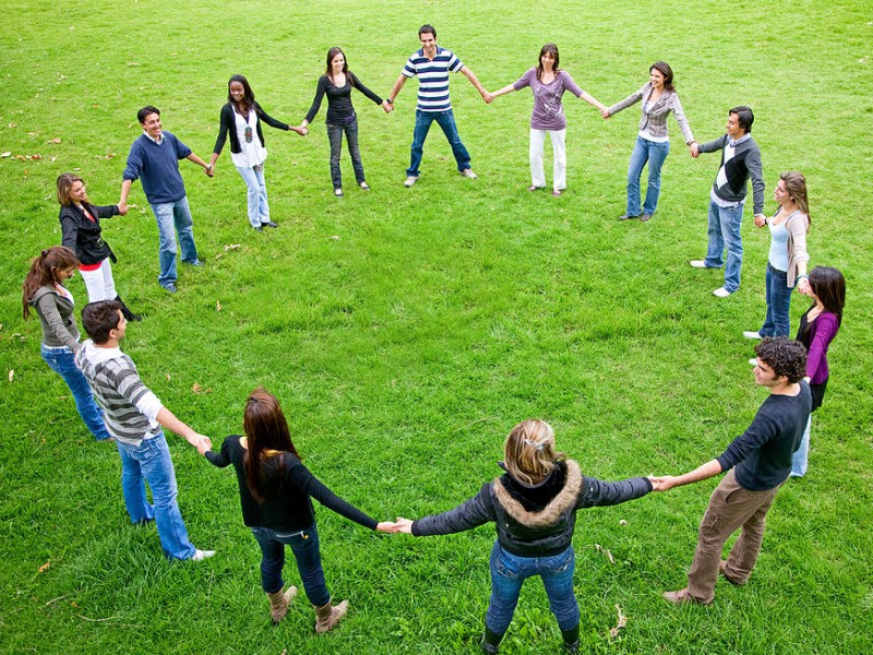 Image of a group of people standing in a circle