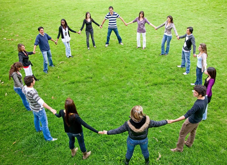Image of a group of people standing in a circle