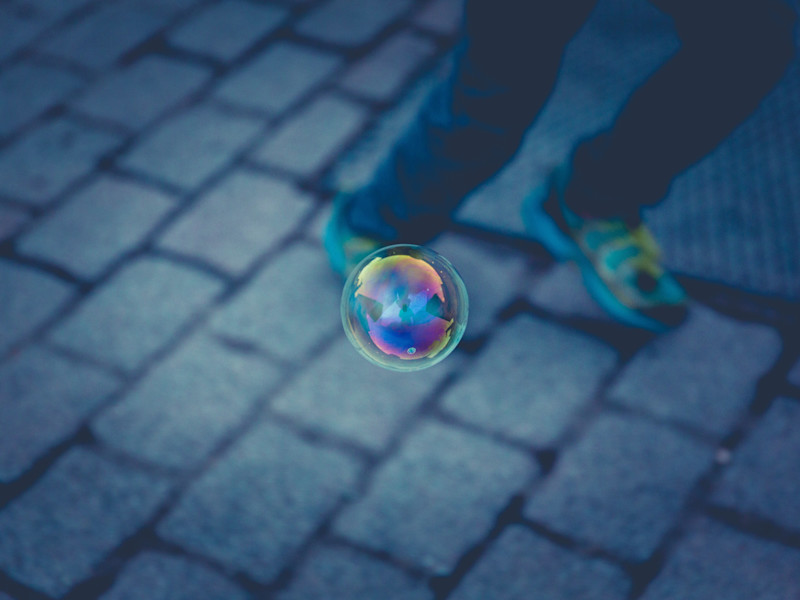 Image looking down a bubble floating through the air