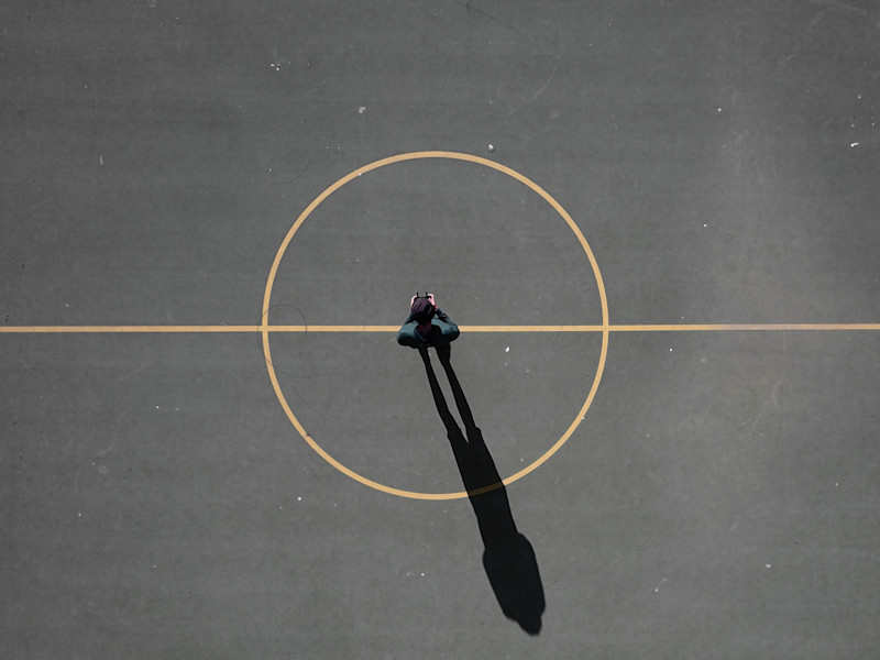 Image looking down on a center circle on a sports pitch