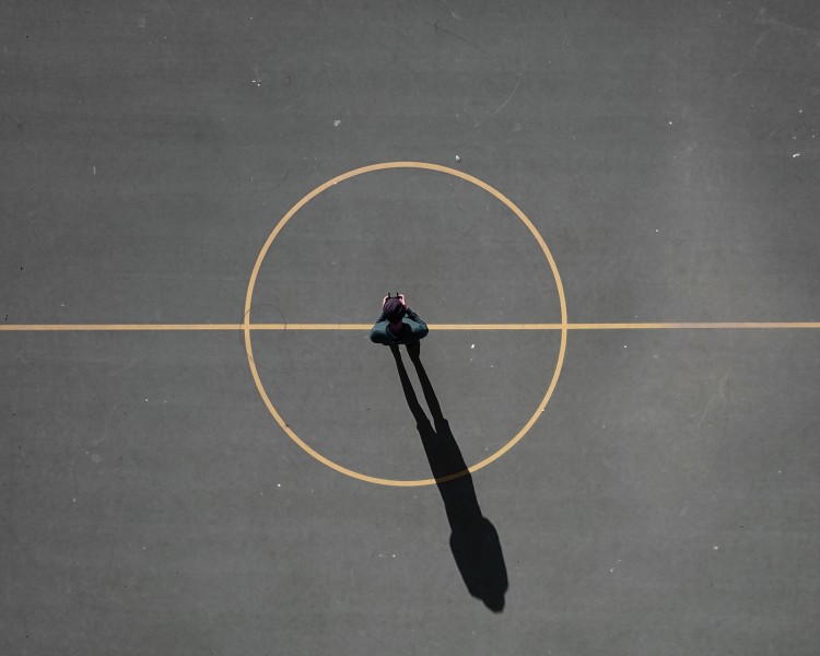 Image looking down on a center circle on a sports pitch