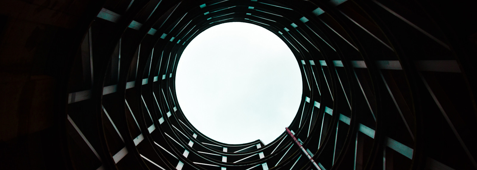 Image looking up to the sky through a circular structure