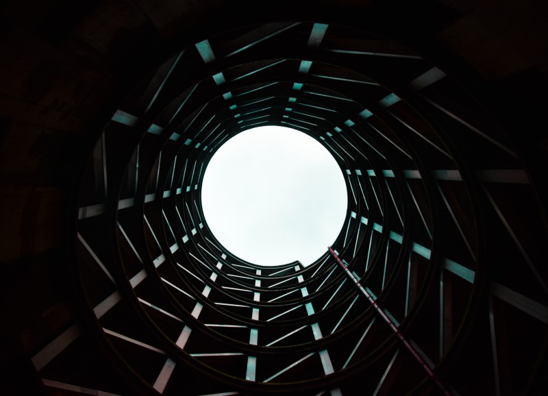 Image looking up to the sky through a circular structure