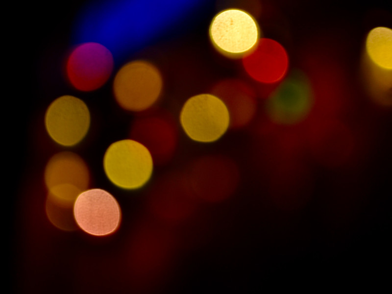 image of a close up of out of focus lights against a dark background