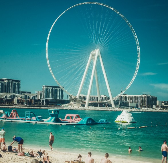 Image of a view of a Ferris wheel from a beach