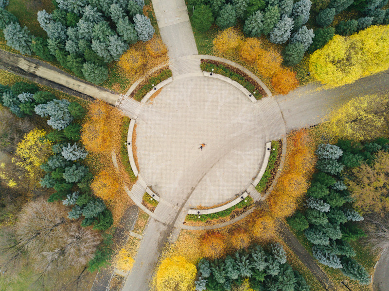 Aerial video of a circular structure surrounded by trees