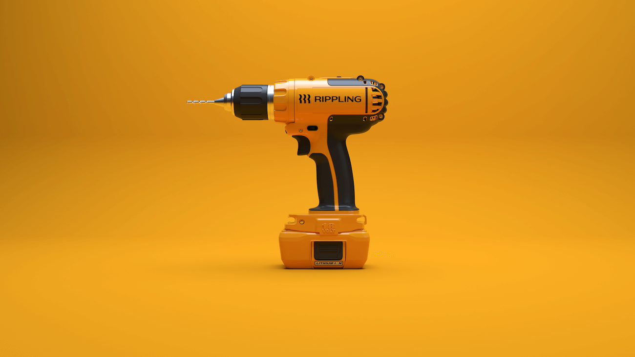 A photograph of a power drill with the Rippling logo printed on its side