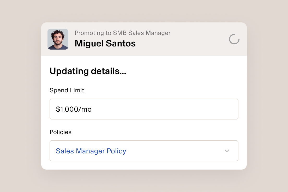 Employee promotion interface showing Miguel Santos being promoted to SMB Sales Manager with $1,000/mo spend limit.
