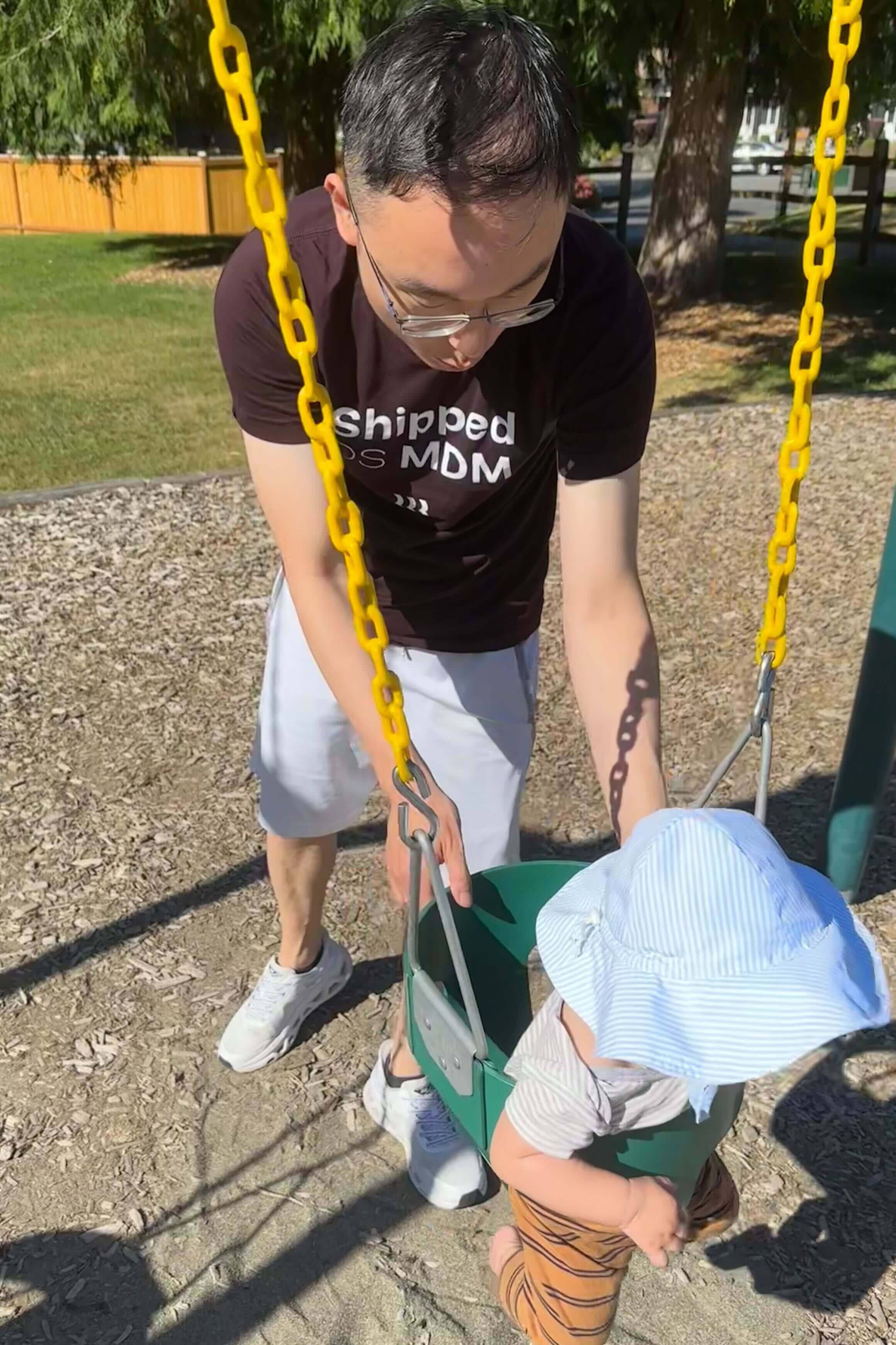 Jihai Xu with his son at the park.