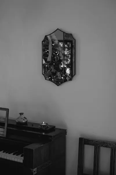 Reimi Mirror 02 with Lisa Eisner Urchin Votives on the piano.