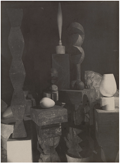 “Untitled (View of the Studio with Endless Column, Beginning of the World, Adam and Eve, Bird in Space, and Torso of a Young Girl”, Constantin Brancusi, 1922, via MoMA