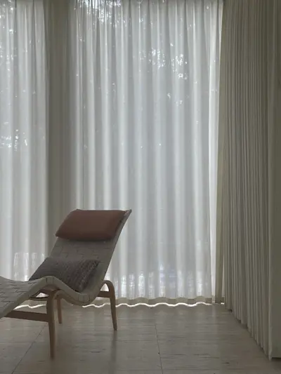 Diaphanous drapery and Bruno Mathsson loungers.
