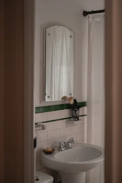 R+D Lab Gray Glassware holding a rose in the bathroom.