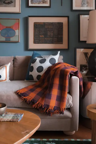 Handwoven wool throw by Marina Contro draped over our Turkish Sofa for George Smith