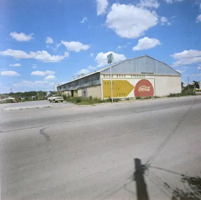 South facade of east building from US Highway 90. Photo 1973.