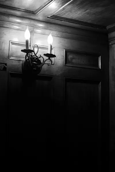 Wood paneled elevator operated by a Rolls Royce engine.