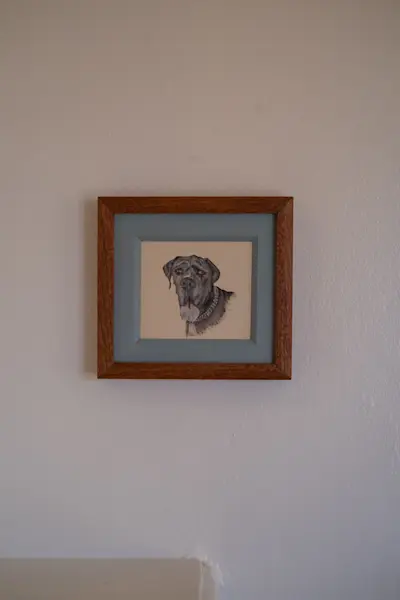 A painting of Josie's dog, Atticus, by Dan Bruinooge.